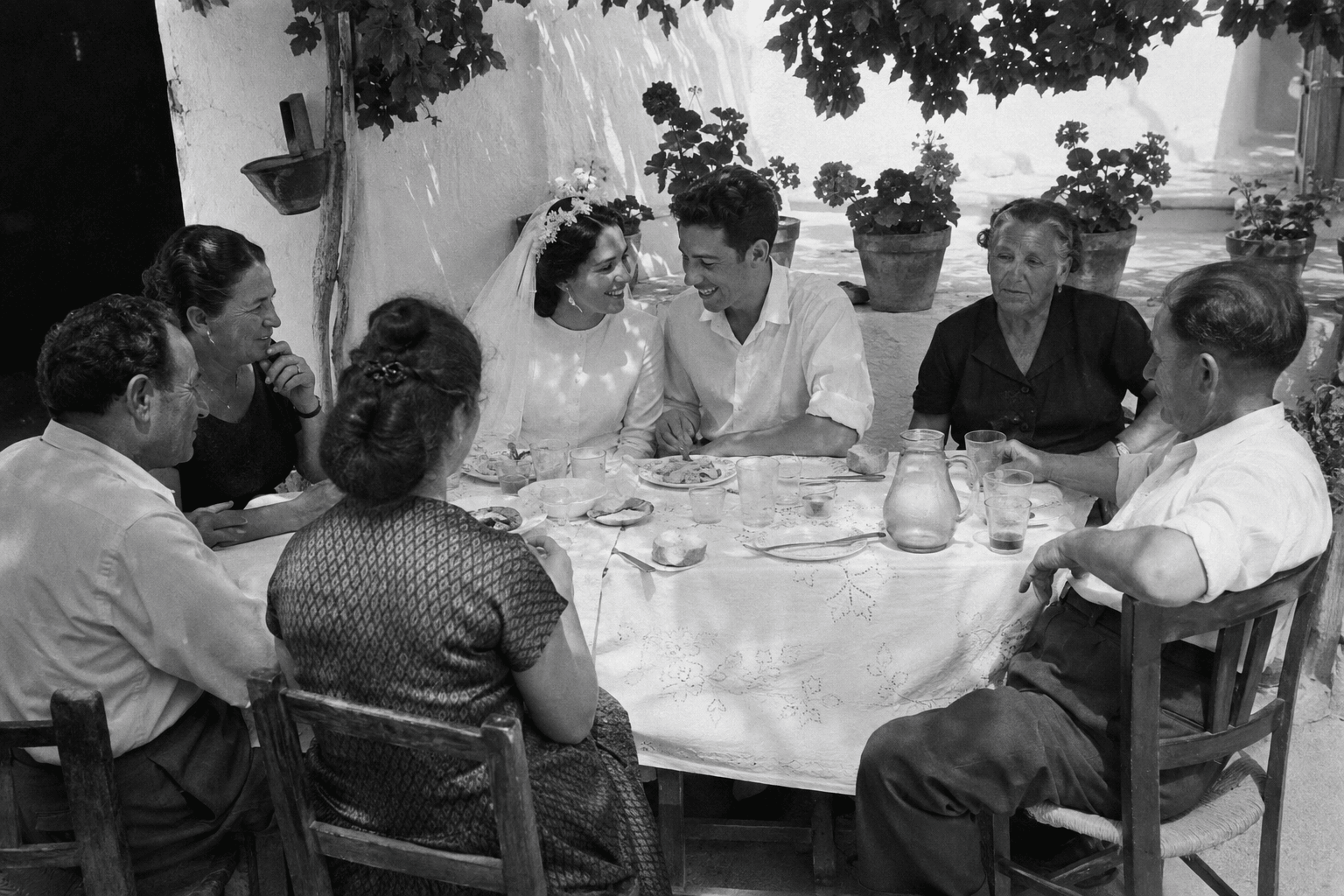 An illustrative black-and-white family wedding photograph used in Geranium